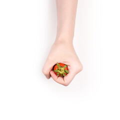 Close up of woman hand holding one strawberry isolated on white background.
