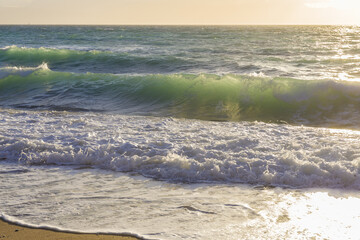 Sea waves at the coastline on a sunny day