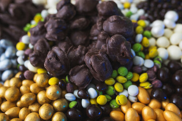 Assorted from a variety of different sweets in the glaze of white and dark chocolate, in the sugar glaze.