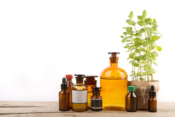 Vintage pharmacy bottles and medical herb isolated on white
