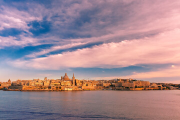 Valletta Skylineat at beautiful sunset from Sliema with churches of Our Lady of Mount Carmel and St. Paul's Anglican Pro-Cathedral, Valletta, Capital city of Malta