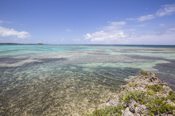 The turquoise shades of the Caribbean Sea seen from the cliffs of Green Island Antigua and Barbuda Leeward Island West Indies