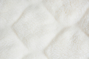 Fototapeta na wymiar White fur close up background. Texture, abstract pattern.