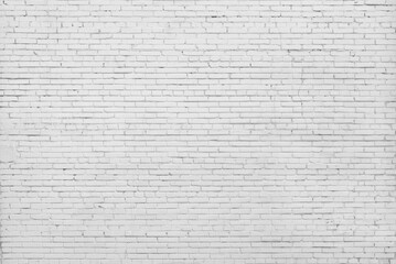 Brick wall painted with white paint.