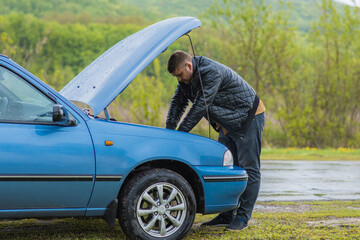 Naklejka premium The driver tries to start a car