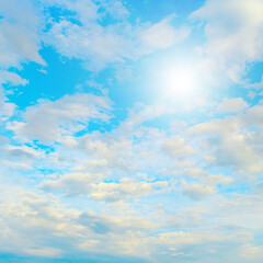 Sun in blue sky and beautiful white clouds.