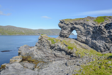 Fototapeta na wymiar Cliff formation Kirkeporten with view to the North Cape Horn, Finnmark, Norway