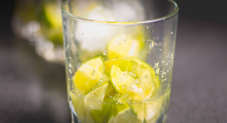 Lime cut in glasses with sugar to make caipirinhas