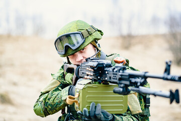 Soldiers of the Russian army with a machine gun aiming at the enemy