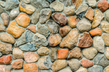 Stone wall made of various sizes stone, can be used as background.