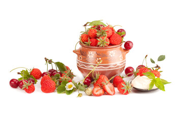 Strawberries with cream and ripe cherry .