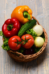 vegetables in basket on blue vintage wooden, eco food concept