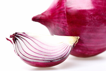 Quarter of onion and whole vegetable behind it
