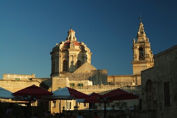 Fototapeta premium The warm sunset light painting the cupola of Saint Paul's Cathedral in Mdina, the old capital of Malta Europe