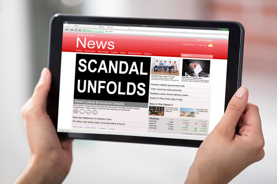 Digital Tablet With A Screen Showing Unfolds Scandal News