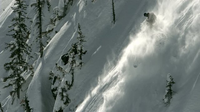Extreme skier conquering a chute in Alaska