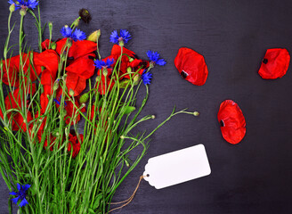 Bouquet of red poppies and blue cornflowers