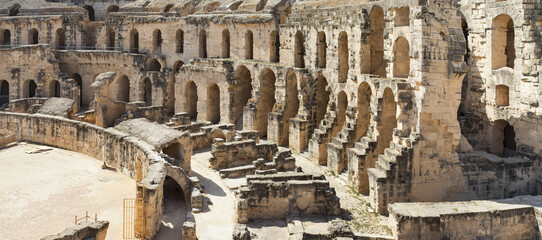 Fototapeta na wymiar wide angle view to ruin of antique amphitheater in Tunisia