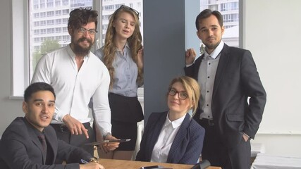Portrait of young successful businessman. Company employees in the office. Business dress code.