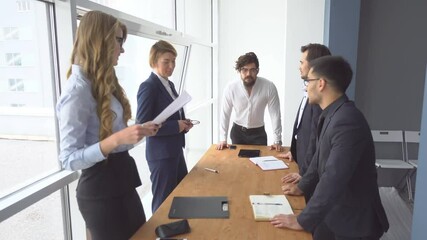 Beginning businessman met at the negotiating table. Young hipsters discussing a business startup
