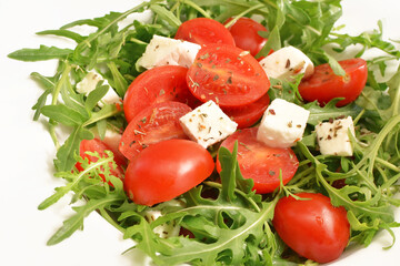 salad with tomatoes, fresh arugula and mozzarella