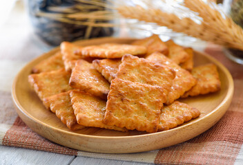 Tasty biscuits in wood plate