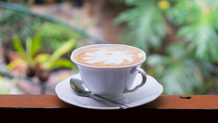 Latte coffee and green nature view