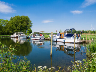 Fototapeta na wymiar Motor boats moored at Lake Brielse Meer, Netherlands