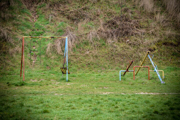 Empty playground with swing and teeter