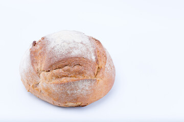 Rustic medieval loaf of bread isolated on white background
