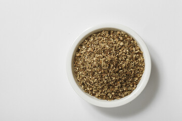Bowl of dried oregano leaves