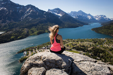 Girl looking from the view of Bear's Hump in Waterton National Park, Alberta