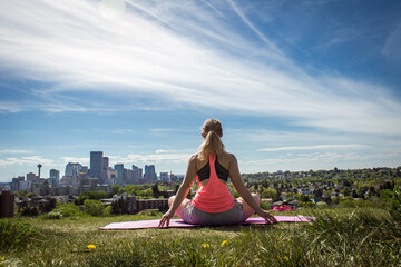 Yoga exercising with the view of Calgary 