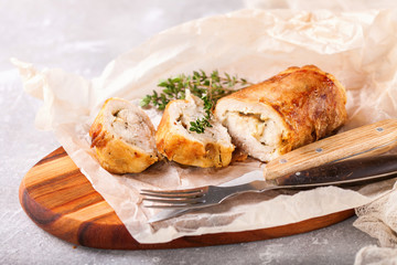 Chicken roll and vegetables on a table. Selective focus. Copy space