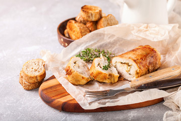 Chicken roll and vegetables on a table. Selective focus. Copy space