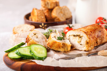 Chicken roll and vegetables on a table. Selective focus. Copy space