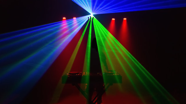 Disc jockey, DJ, silhouette with laser light