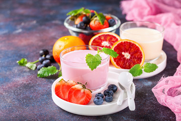 Strawberry yogurt  on a table. Selective focus. Copy space