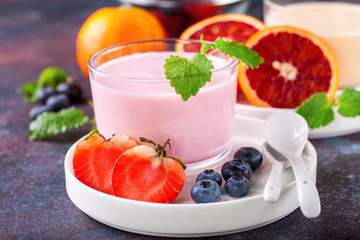 Strawberry yogurt  on a table. Selective focus. Copy space