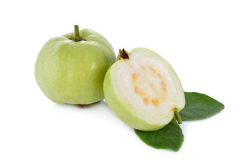 whole and half cut fresh guava with leaves on white background