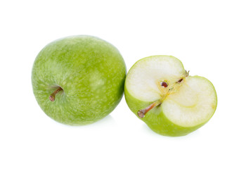 whole and half cut fresh green apple with stem on white background
