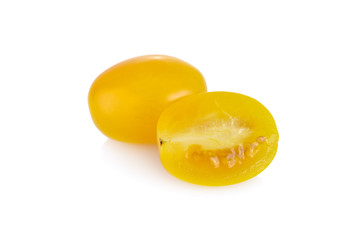 whole and half cut yellow cherry tomato on white background