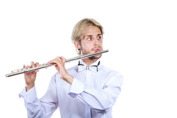 Male flutist playing his flute