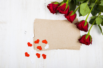 Red rose, hearts and paper for congratulations