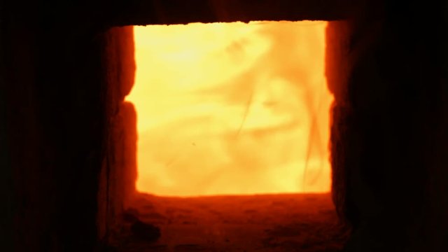 4K Close -up shot that A hot flame is burning in a porcelain kiln.