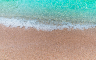 Soft Wave Of Blue Ocean On Sandy Beach. Background. Selective focus.Background concept.
