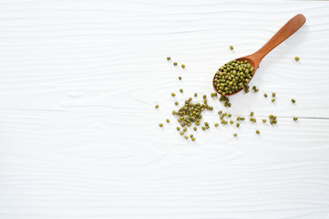 green bean in wooden bowl isolated on white background