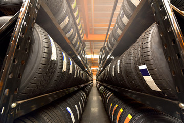 Tire rubber products , Group of new tires for sale at a tire store. © sirisakboakaew
