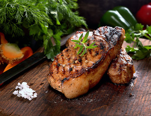juicy grilled steaks on a cutting board