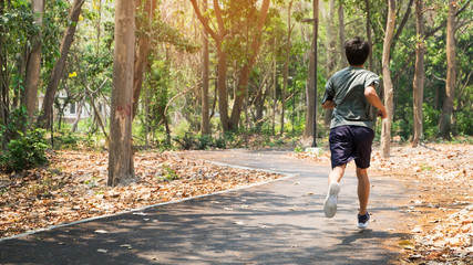 Fototapeta premium running man. Male runner at sprinting speed training for marathon outdoors